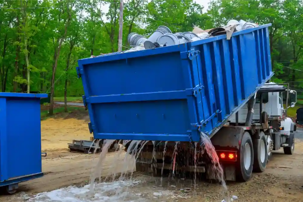 Roll-off dumpster with swinging door and open top in Quincy IL